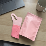 HydroHeat wrist wrap laid flat on a desk with a pouch
