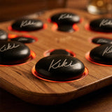 Close-up of Kiki-branded basalt stones in warm glowing heated wells
