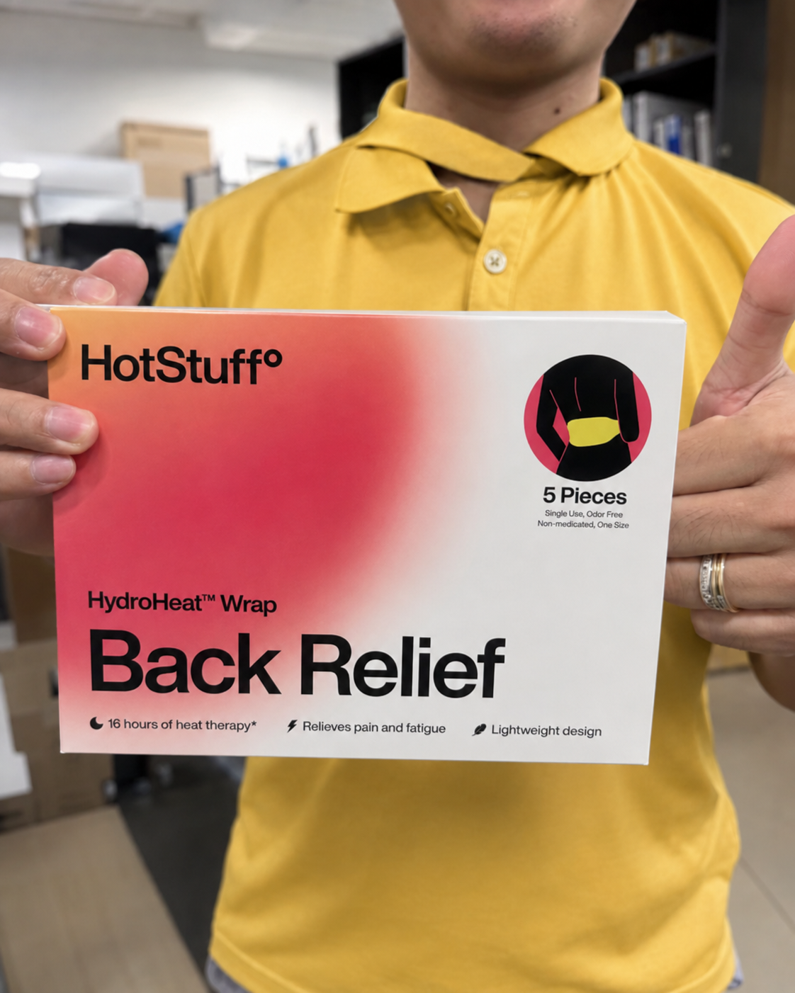 A member of the Sunday Rituals team holding a HotStuff HydroHeat Back Relief pack